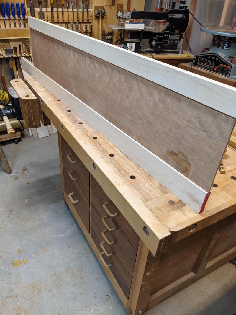 Prefinishing the veneered front panel.