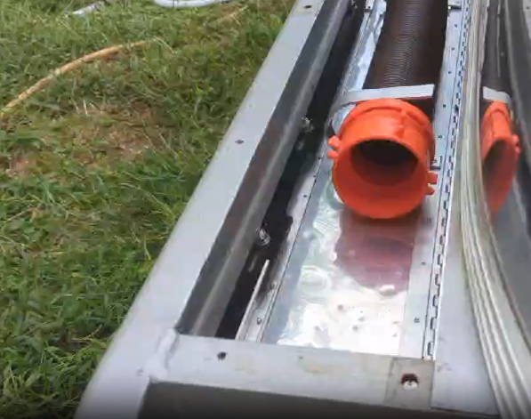 The sewer-hose caddy in the bumper.