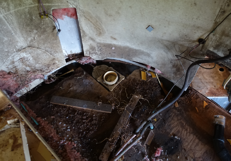 The rear floor material removed and hauled off.